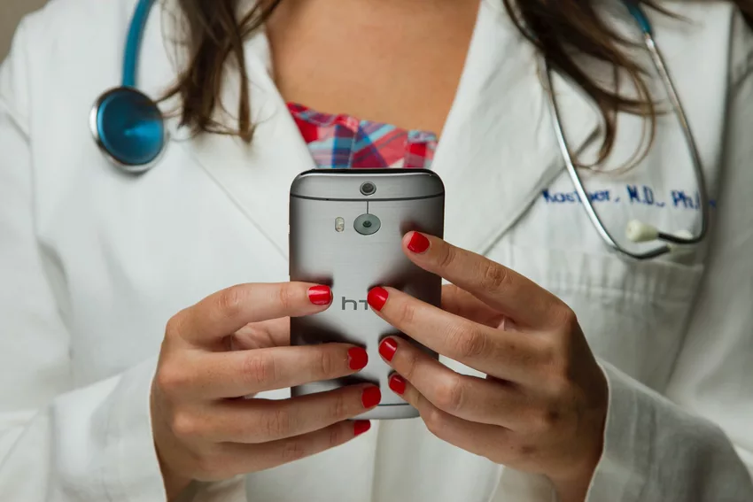 Healthcare Professional looking at a smartphone